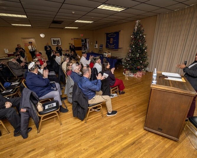 Esther Chucaralao, director, Veteran Services, NJDMVA addresses attendees of the NJ State Medal Ceremony 12 17 25